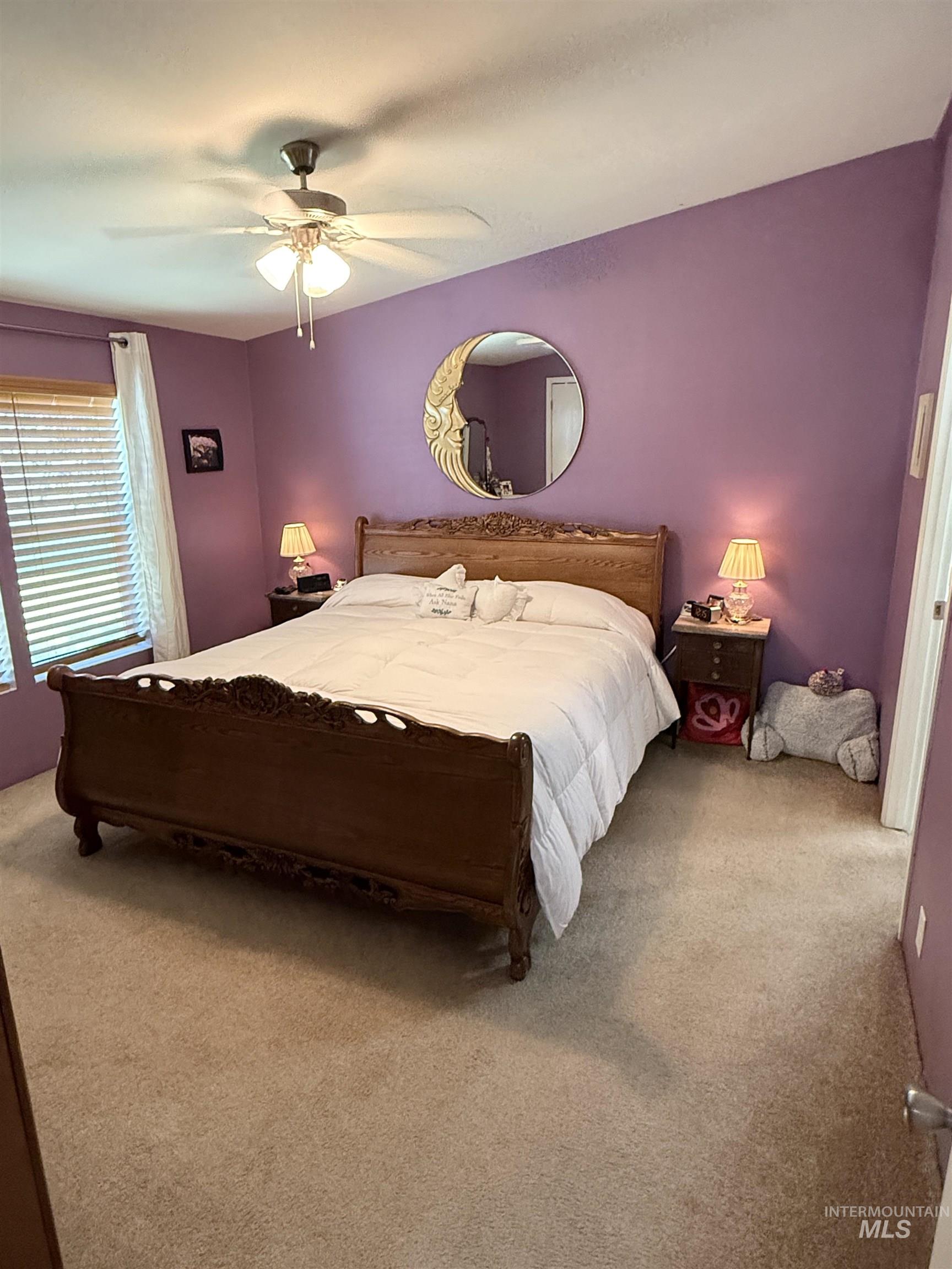 2750 Alden Road, Unit 12 12 Fruitland, ID 83619 - Photo 24 of 38 Carpeted room with light blue walls and a central window featuring patterned curtains