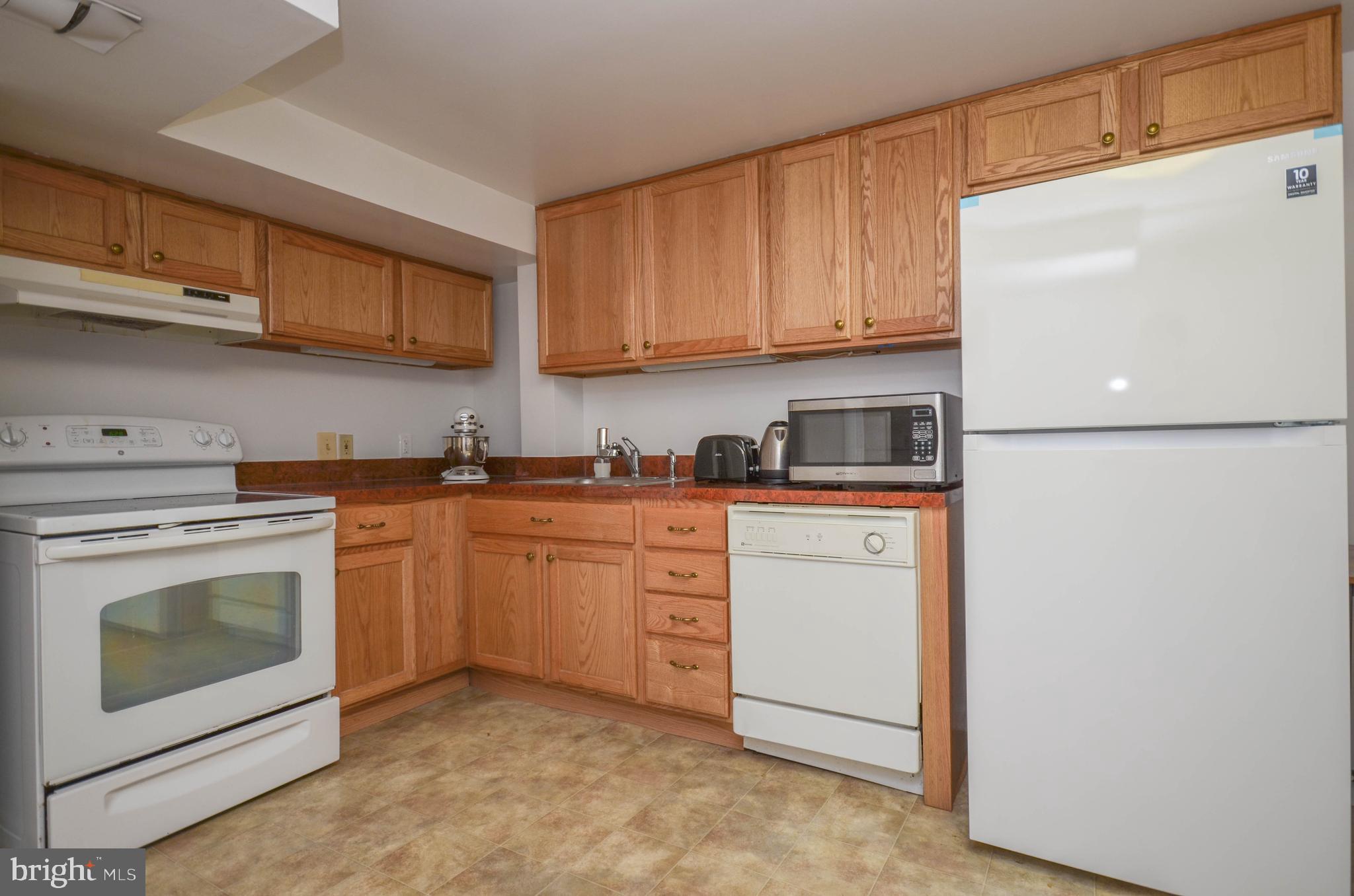 12907 Crisfield Road Silver Spring, MD 20906 - Photo 35 of 51 Basement kitchen (stove will be removed)