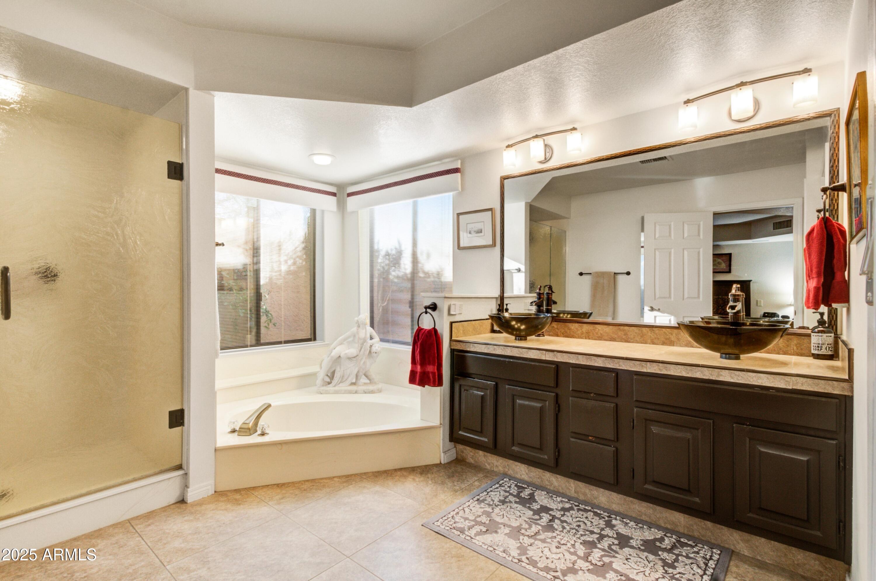 18919 East Reata Drive Rio Verde, AZ 85263 - Photo 15 of 35 a bathroom with a tub sink shower and mirror