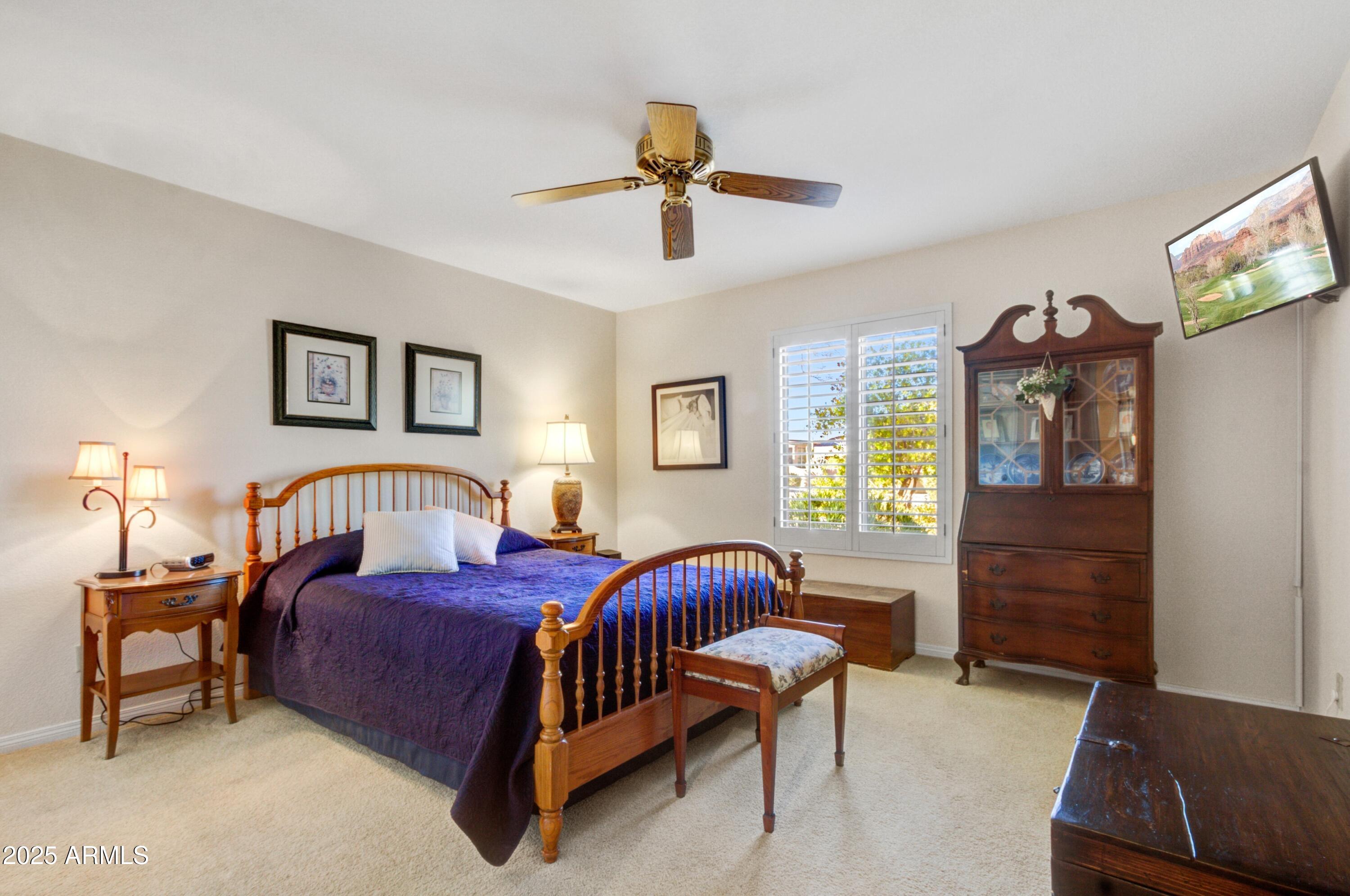18919 East Reata Drive Rio Verde, AZ 85263 - Photo 16 of 35 a bedroom with a bed couch and window