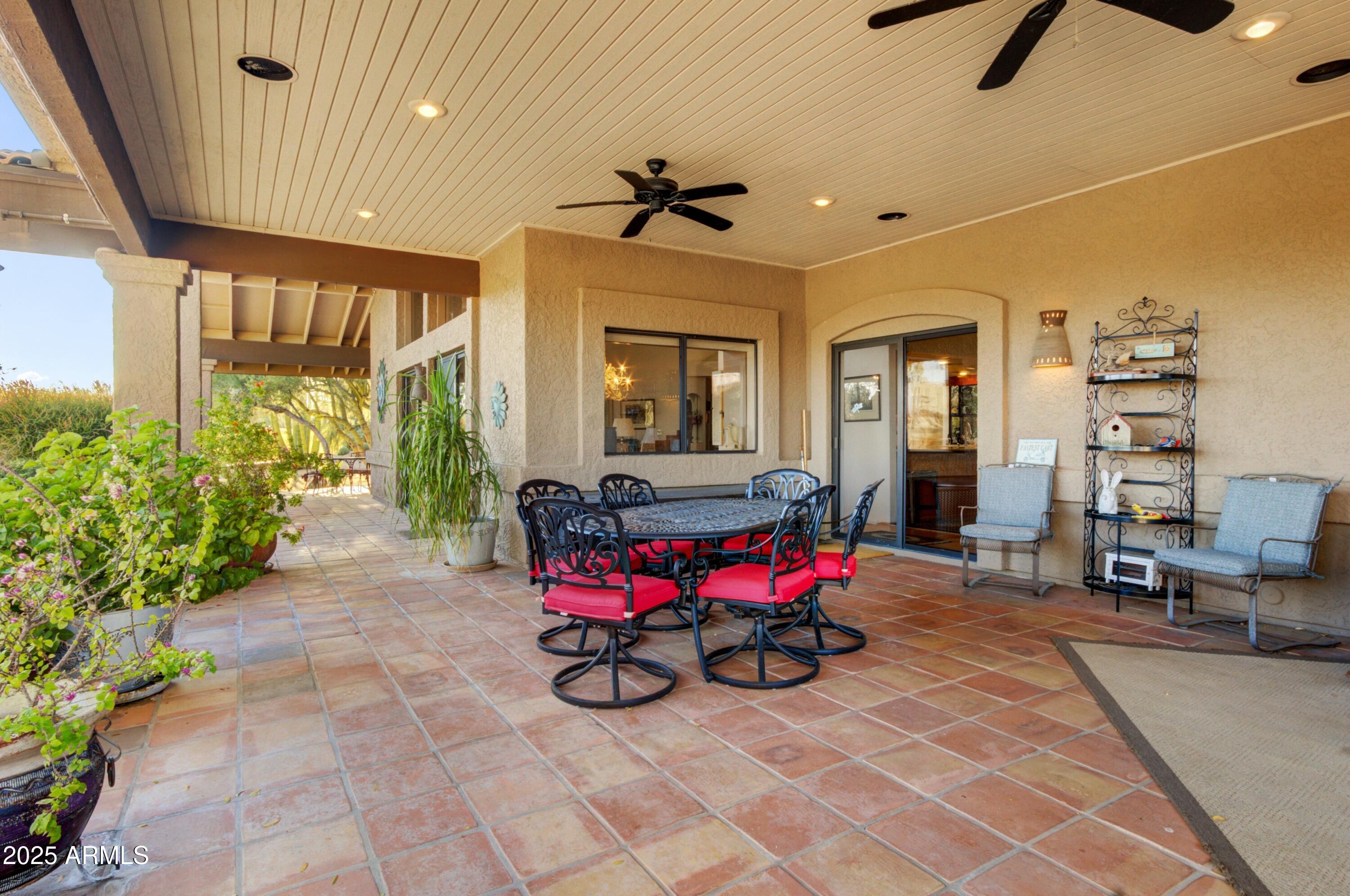 18919 East Reata Drive Rio Verde, AZ 85263 - Photo 24 of 35 a living room with furniture and a chandelier
