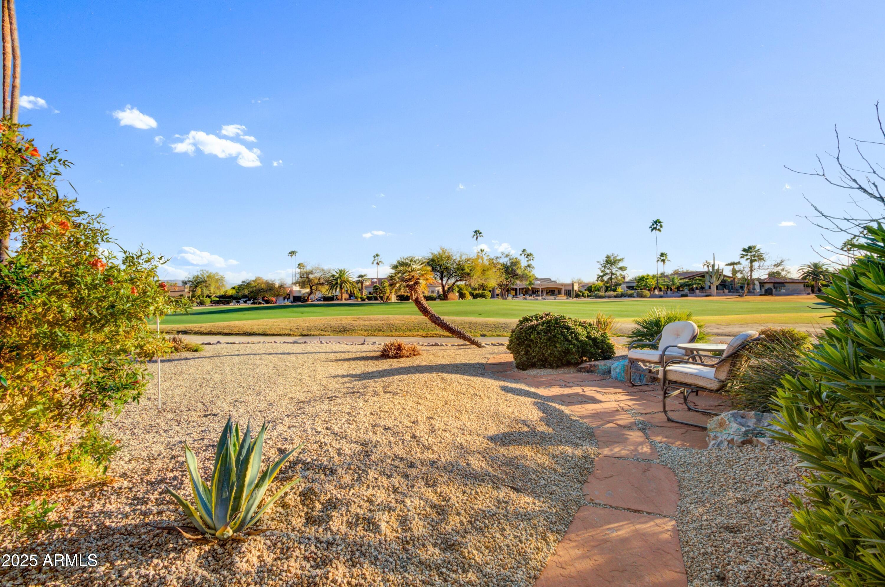 18919 East Reata Drive Rio Verde, AZ 85263 - Photo 26 of 35 a view of a lake with lawn chairs and a table
