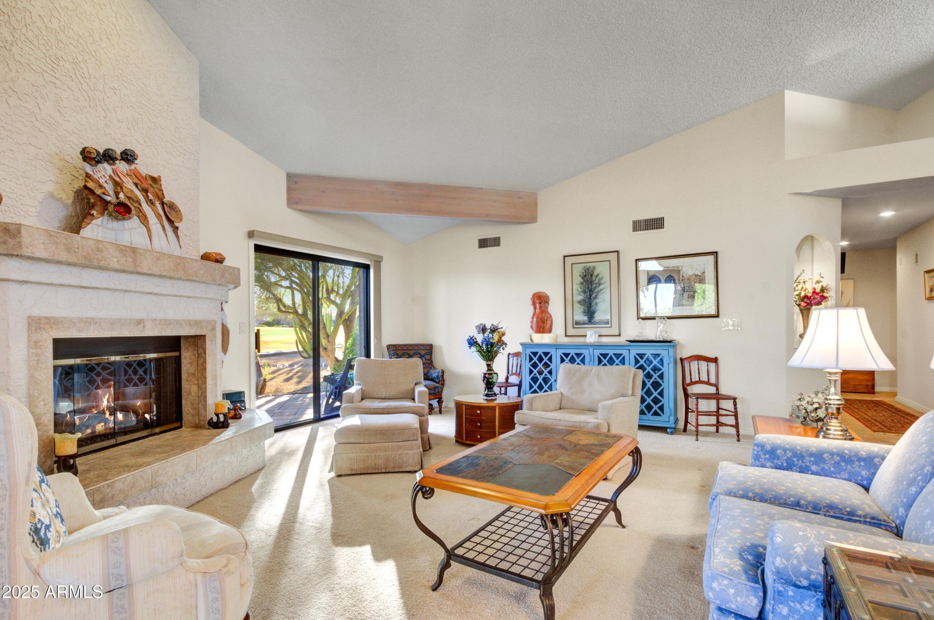 18919 East Reata Drive Rio Verde, AZ 85263 - Photo 6 of 35 a living room with furniture fireplace and a fireplace