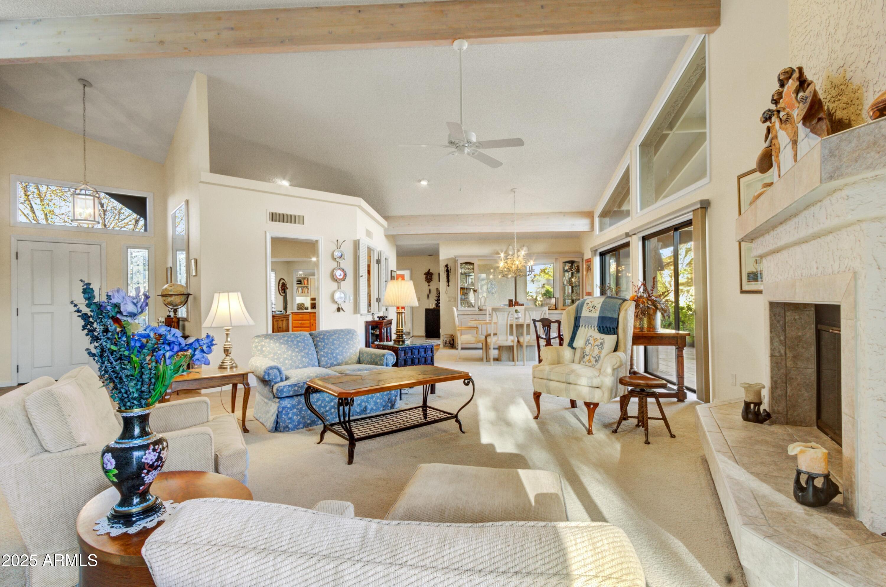 18919 East Reata Drive Rio Verde, AZ 85263 - Photo 8 of 35 a living room with fireplace furniture and a large window