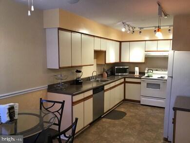 9301 Palmer Place, Unit 40 Laurel, MD 20708 - Photo 5 of 12 Modern kitchen with sleek cabinetry.