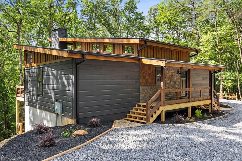 307 Mangum's Trail Blue Ridge, GA 30513 - Photo 1 of 36 a view of outdoor space with porch and wooden fence
