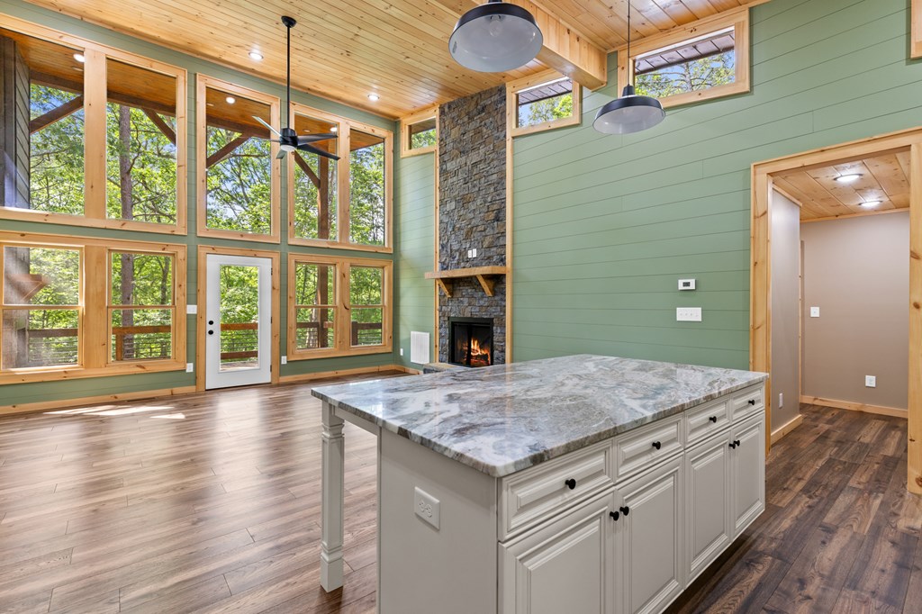 307 Mangum's Trail Blue Ridge, GA 30513 - Photo 18 of 36 a bathroom with a granite countertop sink and a large mirror
