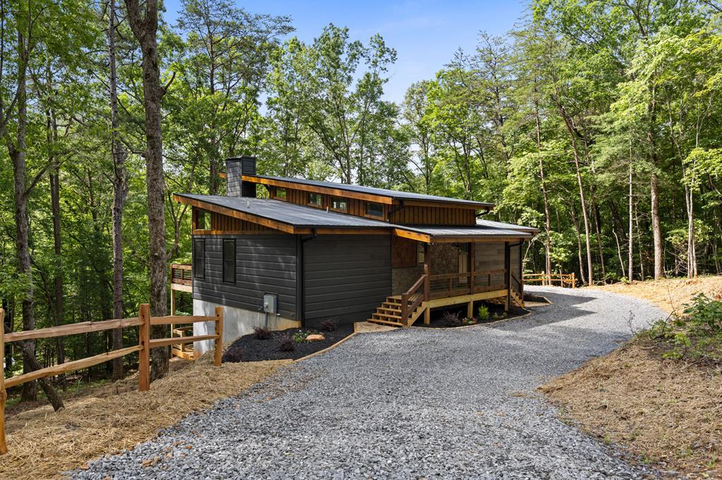 307 Mangum's Trail Blue Ridge, GA 30513 - Photo 2 of 36 a view of back yard and deck