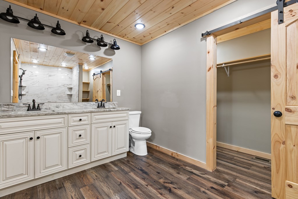 307 Mangum's Trail Blue Ridge, GA 30513 - Photo 22 of 36 a spacious bathroom with a granite countertop sink toilet and shower
