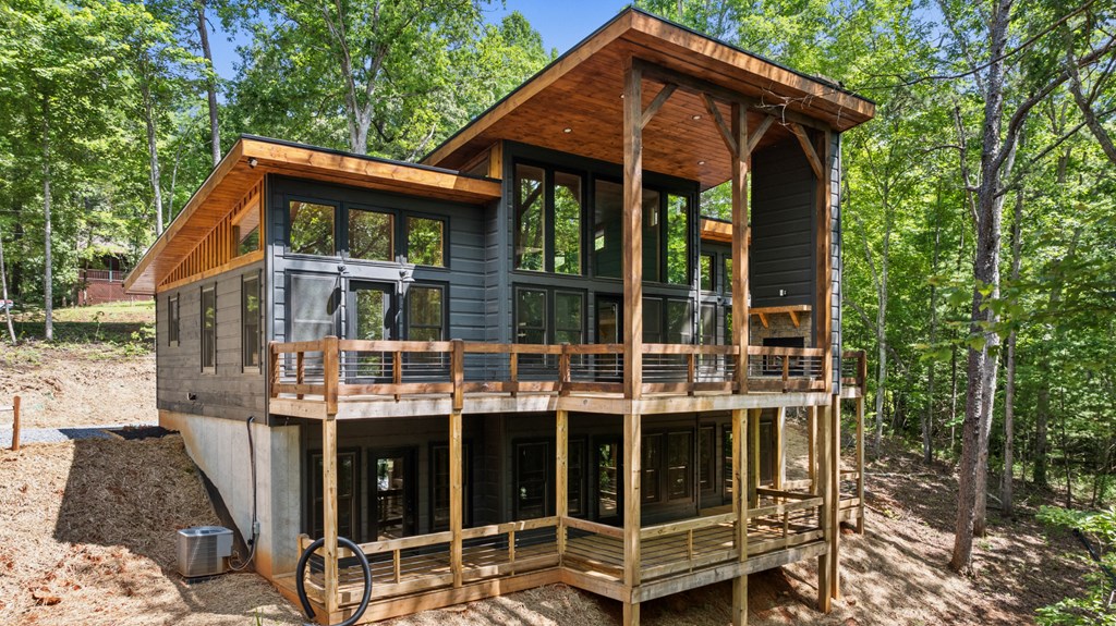 307 Mangum's Trail Blue Ridge, GA 30513 - Photo 8 of 36 a blue and white house with a outdoor space