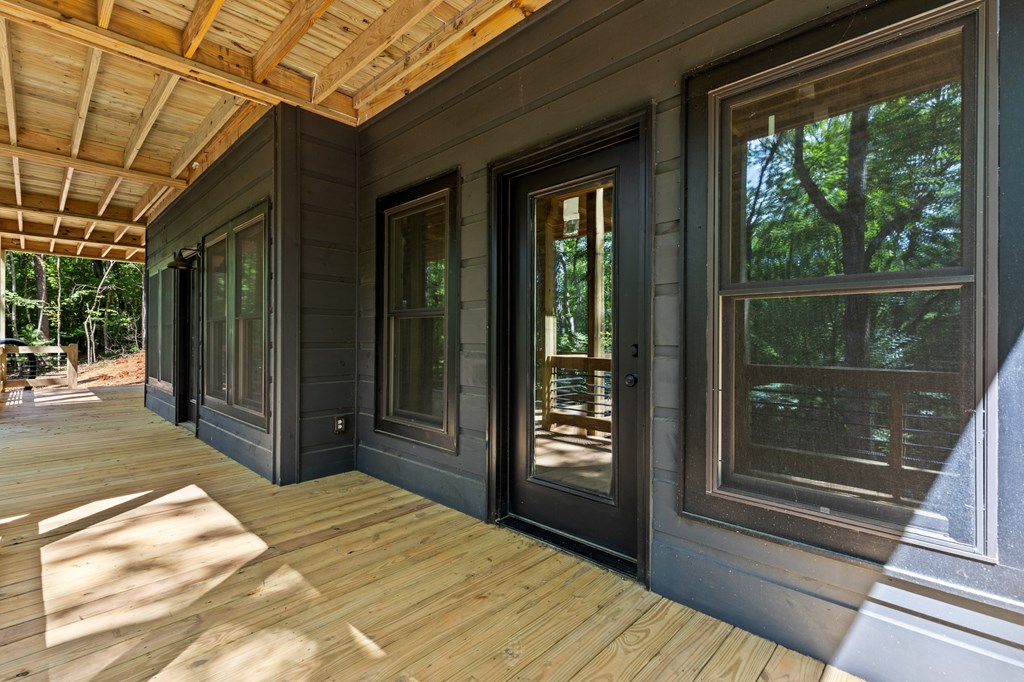 307 Mangum's Trail Blue Ridge, GA 30513 - Photo 9 of 36 a bedroom with a bed and wooden floor