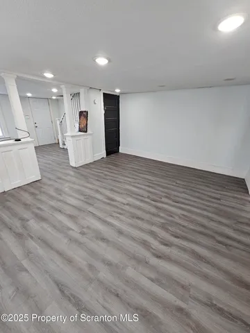 a bathroom with a sink a mirror and a shower