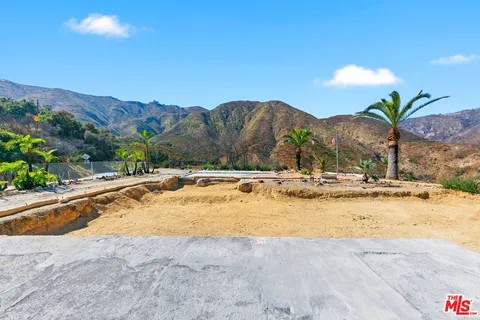a view of swimming pool with a table and chairs
