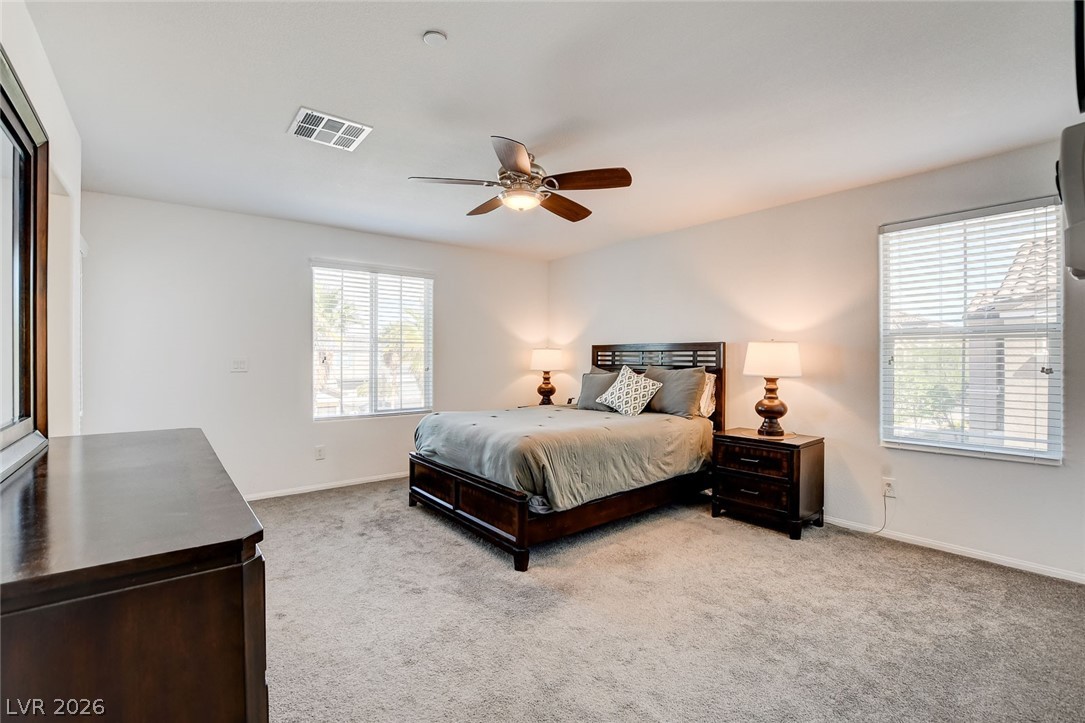 484 Filaree Place Henderson, NV 89015 - Photo 41 of 71 This spacious bedroom offers ample comfort and natural light.