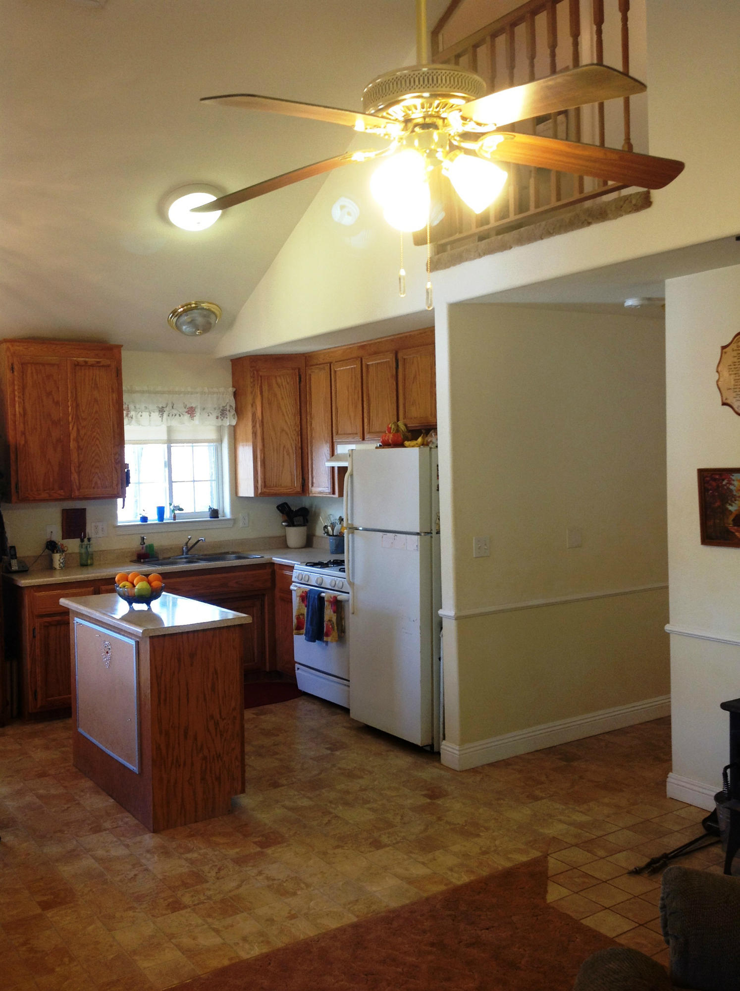 29204 Park Road Bella Vista, CA 96008 - Photo 40 of 41 a kitchen with stainless steel appliances granite countertop a refrigerator a sink dishwasher a stove and a microwave oven on the blue kitchen countertops with a dining table