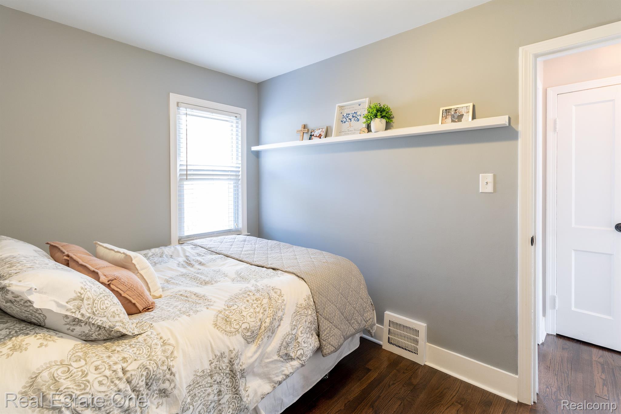 487 Roth Boulevard Clawson, MI 48017 - Photo 20 of 42 Main floor bedroom one with hardwood flooring