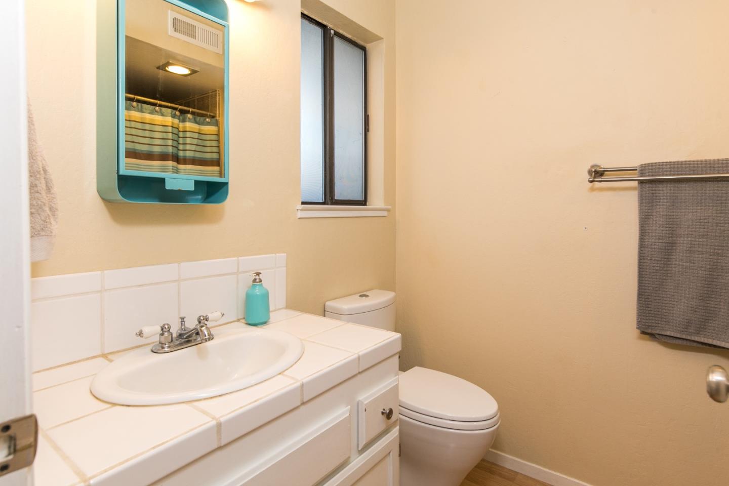 6113 Abbey Road Aptos, CA 95003 - Photo 11 of 20 a bathroom with a sink and a toilet