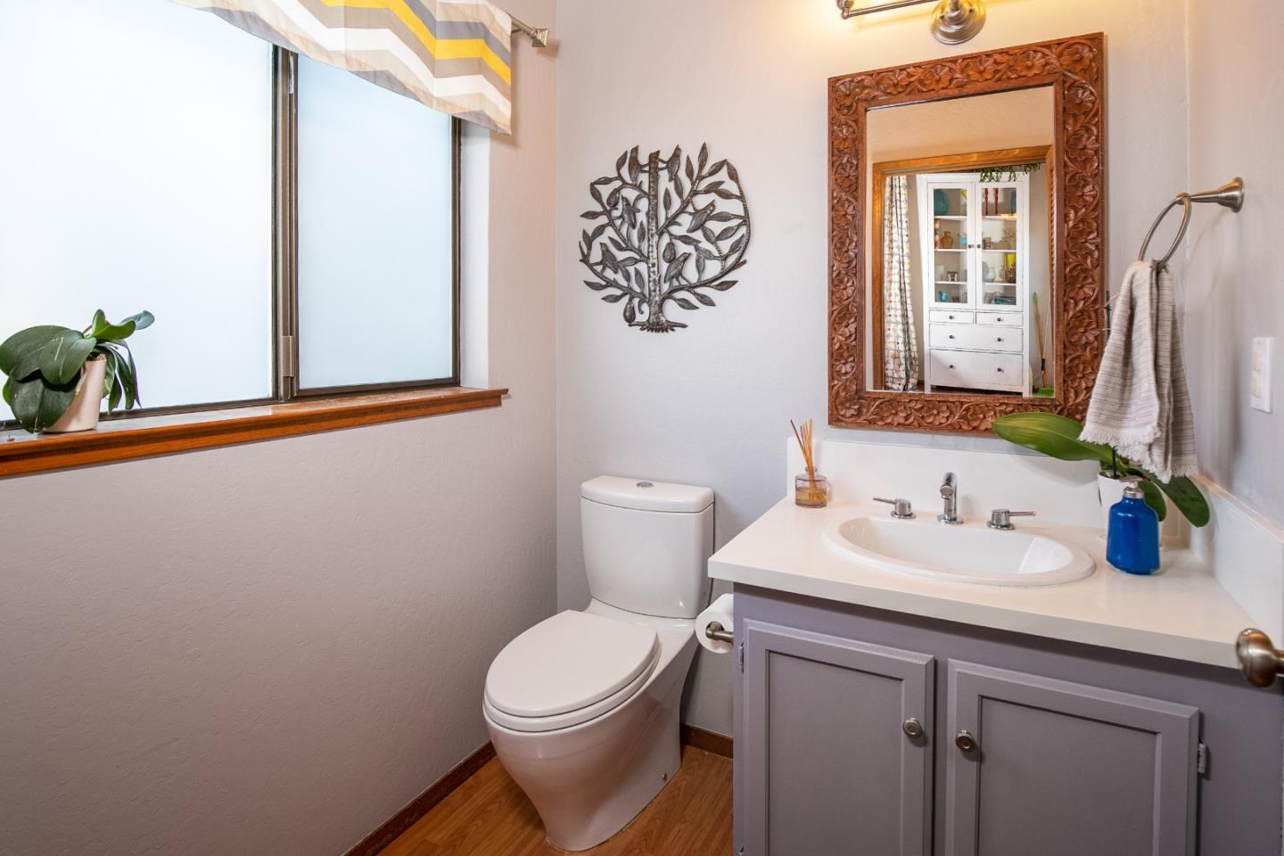 6113 Abbey Road Aptos, CA 95003 - Photo 15 of 20 a bathroom with a toilet sink and mirror
