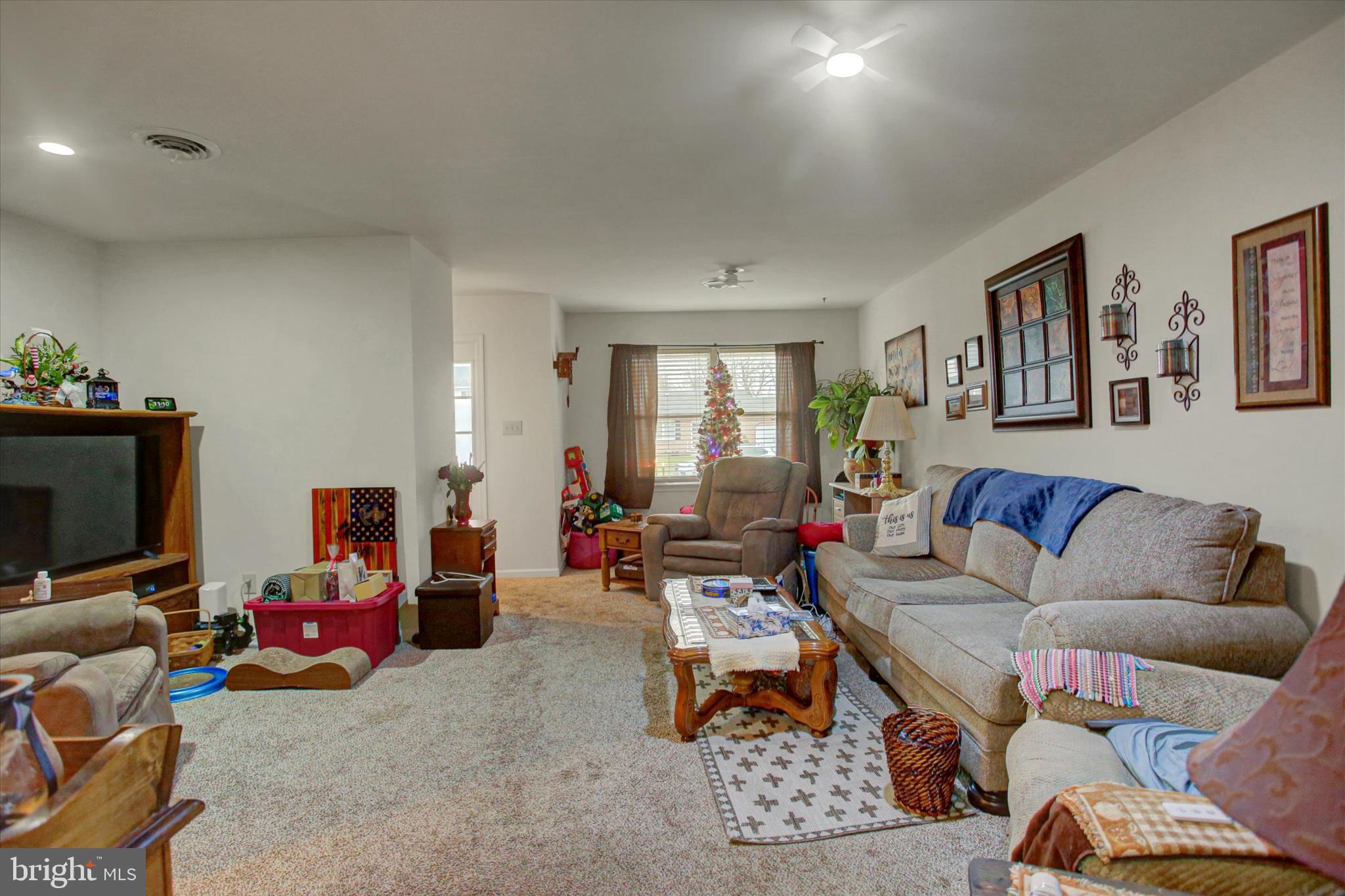 227 Minnich Road Chambersburg, PA 17201 - Photo 12 of 31 a living room with furniture and a flat screen tv