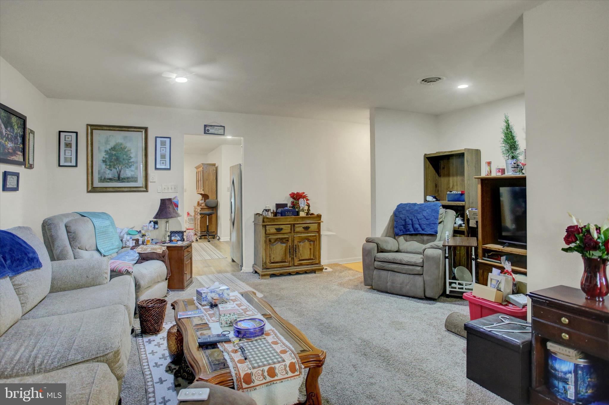 227 Minnich Road Chambersburg, PA 17201 - Photo 15 of 31 a living room with furniture and a flat screen tv