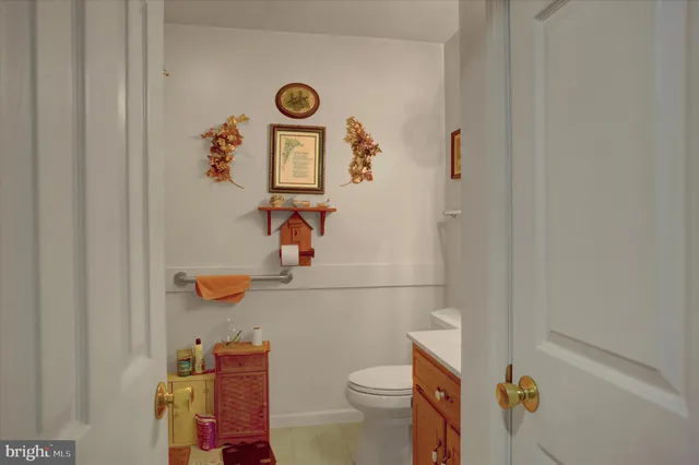 a white toilet sitting next to a bathroom sink