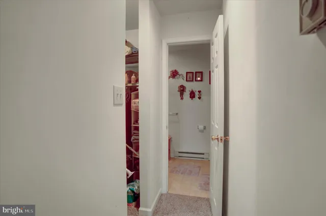 a bathroom with a sink mirror and toilet