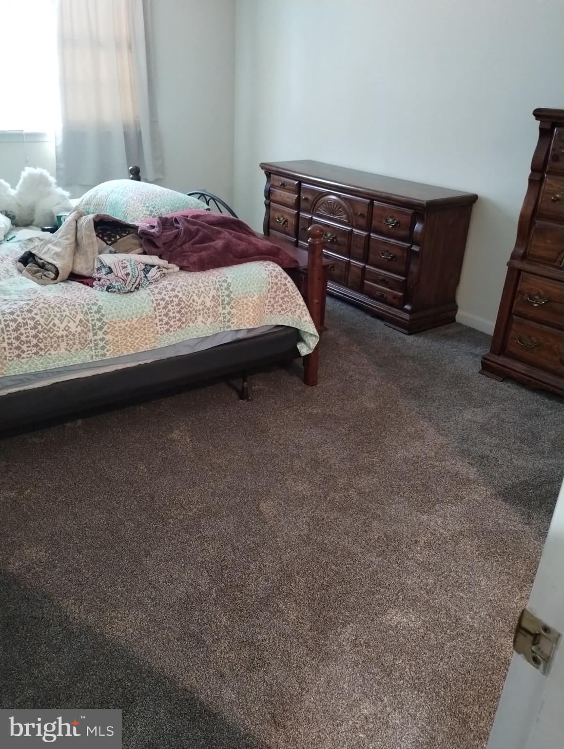 227 Minnich Road Chambersburg, PA 17201 - Photo 27 of 29 a bedroom with a bed and a lamp on the dresser