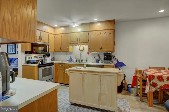 a kitchen with a sink appliances and cabinets