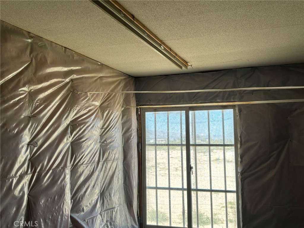 37023 Rabbit Springs Road Lucerne Valley, CA 92356 - Photo 6 of 9 a view of walk in room with windows