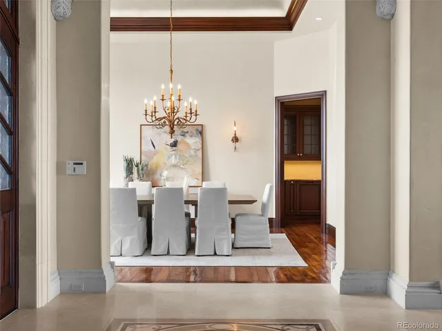 a spacious bathroom with a bathtub a sink and a large mirror