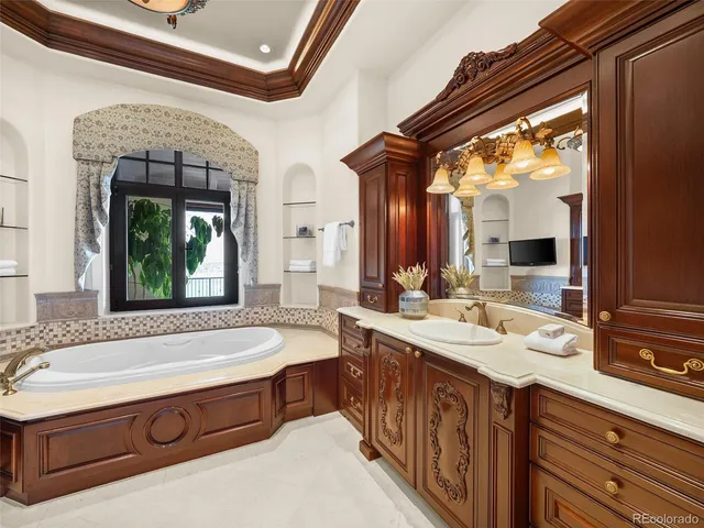 a kitchen with stainless steel appliances granite countertop a refrigerator and a stove