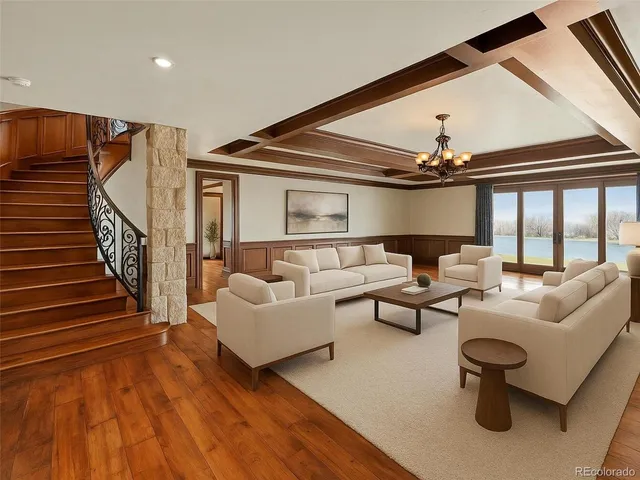 a hallway with furniture and a window