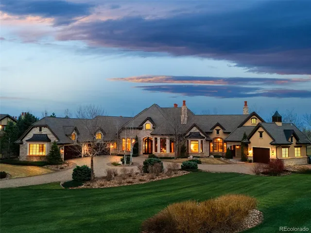 a living room with fireplace furniture and a large window