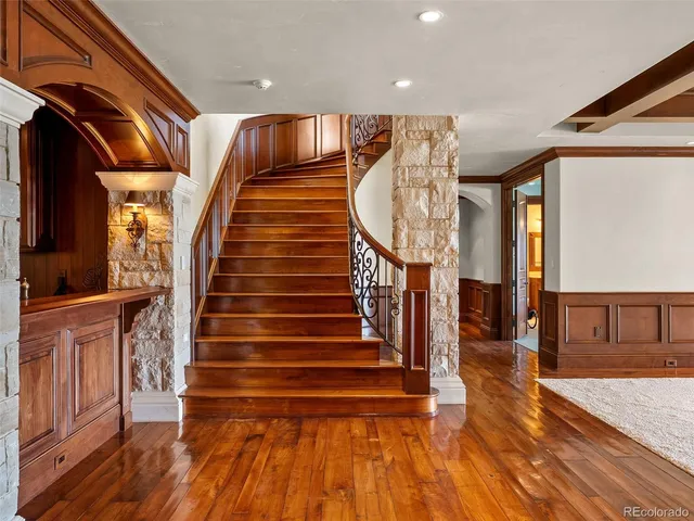 a bathroom with granite countertop a sink and a window