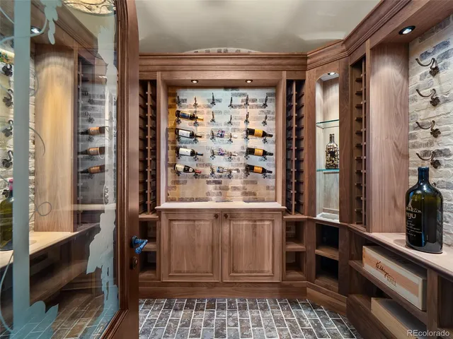 a kitchen with stainless steel appliances granite countertop a refrigerator a stove and a wooden floors