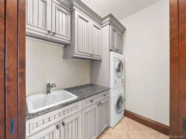 a view of a backyard with lawn chairs and a fire pit