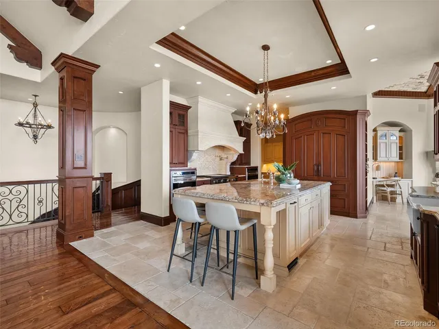 a living room with fireplace furniture and a large window