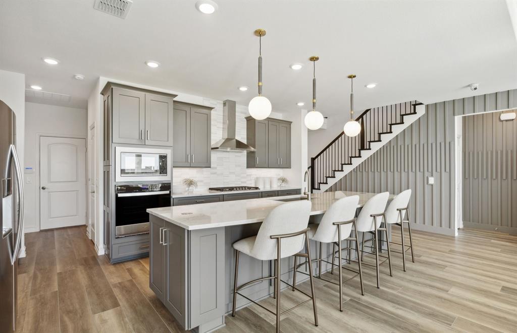 1608 Bennett Drive Anna, TX 75409 - Photo 2 of 11 Spacious kitchen with eat-in bartop island *Model Representation*