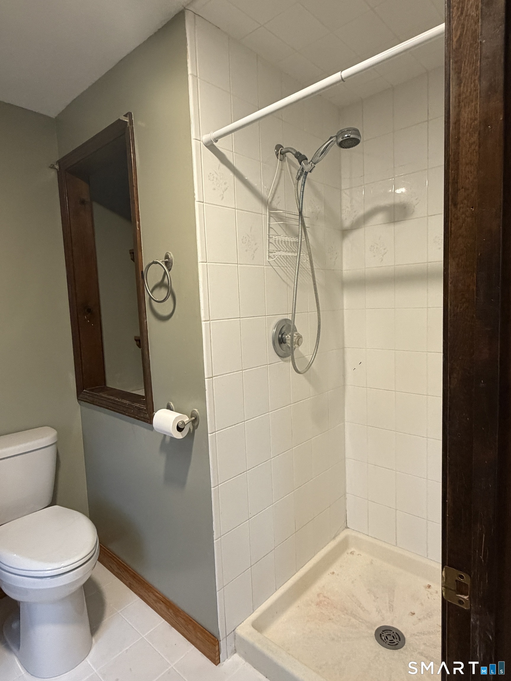 8 Brook Lane, Unit 2 Guilford, CT 06437 - Photo 7 of 12 a bathroom with a shower and toilet