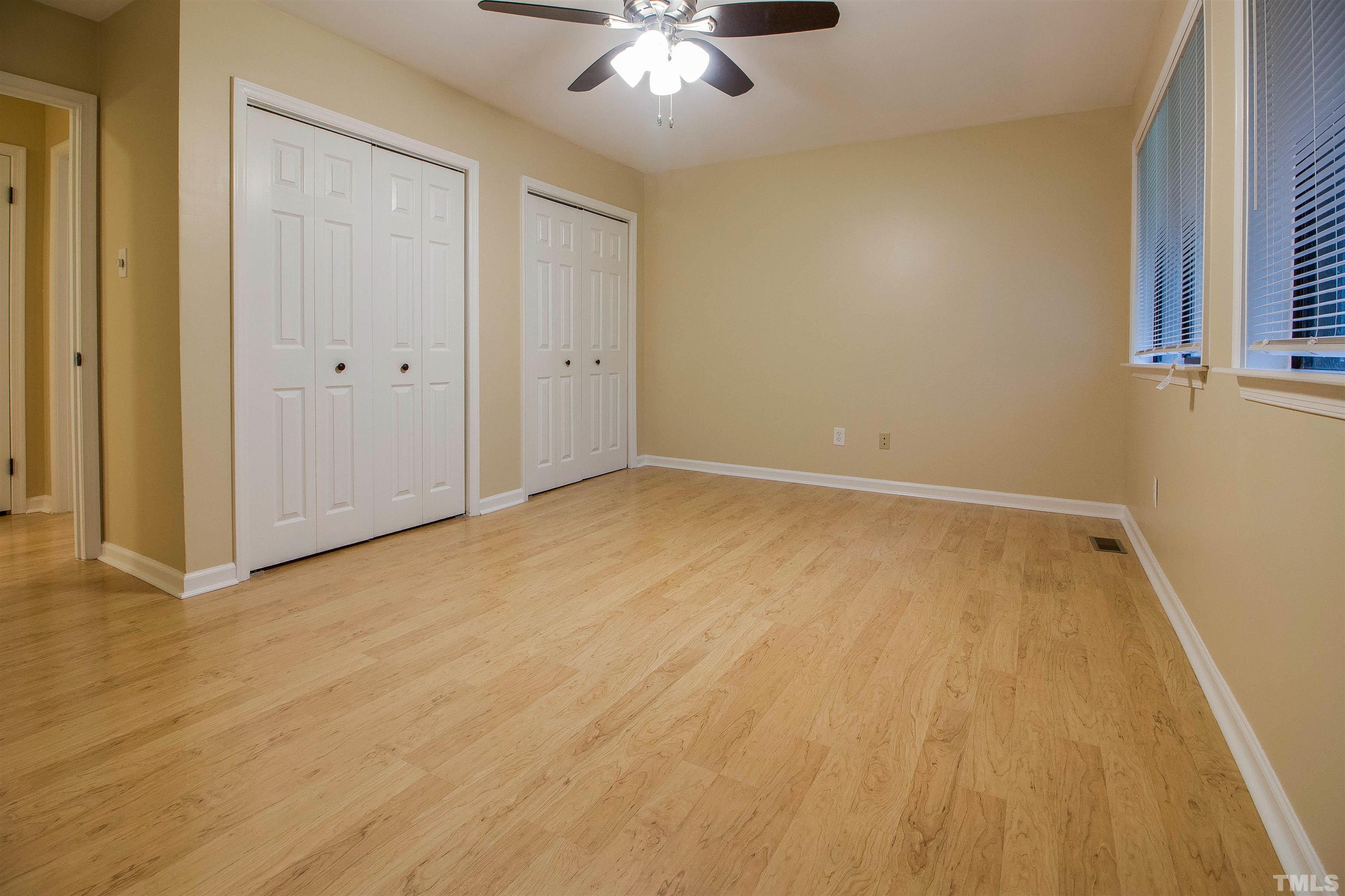 4245 Lake Ridge Drive, Unit 5D Raleigh, NC 27604 - Photo 14 of 23 a view of an empty room and chandelier fan