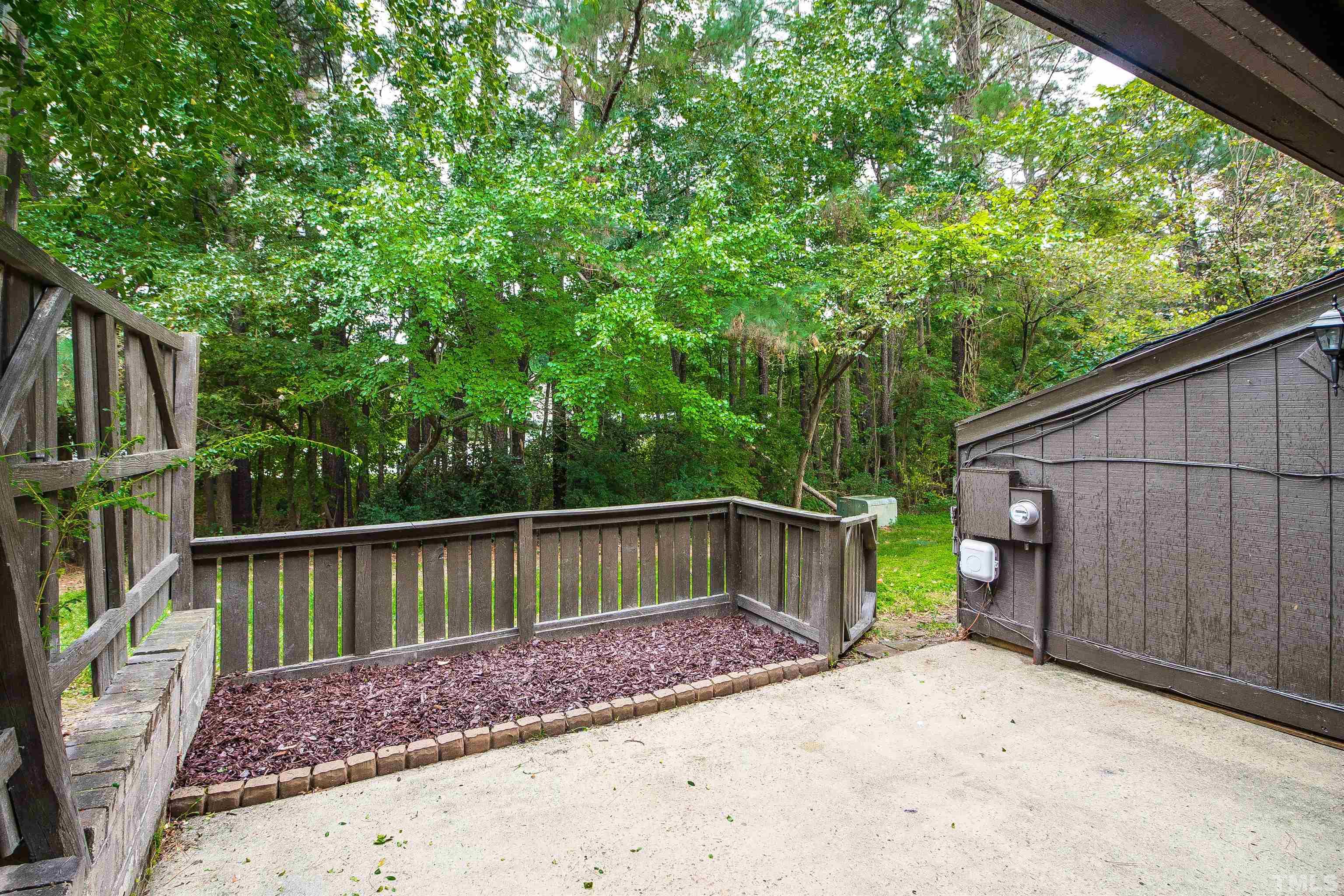 4245 Lake Ridge Drive, Unit 5D Raleigh, NC 27604 - Photo 22 of 23 a view of backyard with deck and outdoor seating