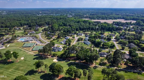 an aerial view of a house with outdoor space