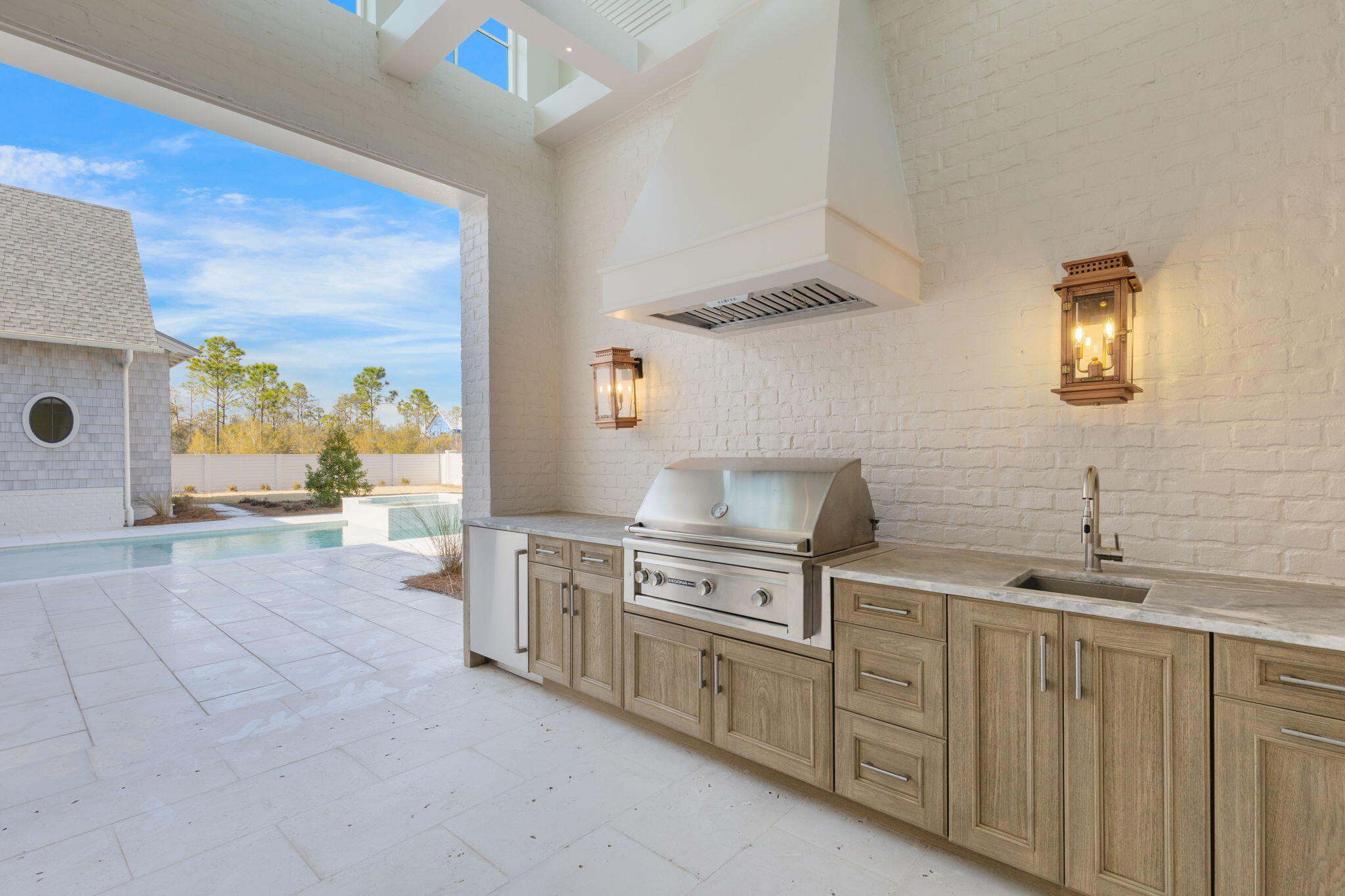 31 Norman Ct Inlet Beach Inlet Beach, FL 32461 - Photo 85 of 104 a kitchen with stainless steel appliances a stove a sink and a refrigerator