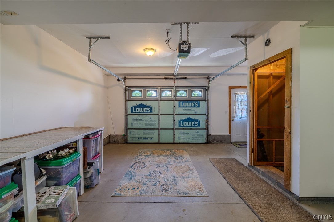 7037 Townline Road Rome, NY 13440 - Photo 37 of 48 Garage with surround sound & lots of storage space