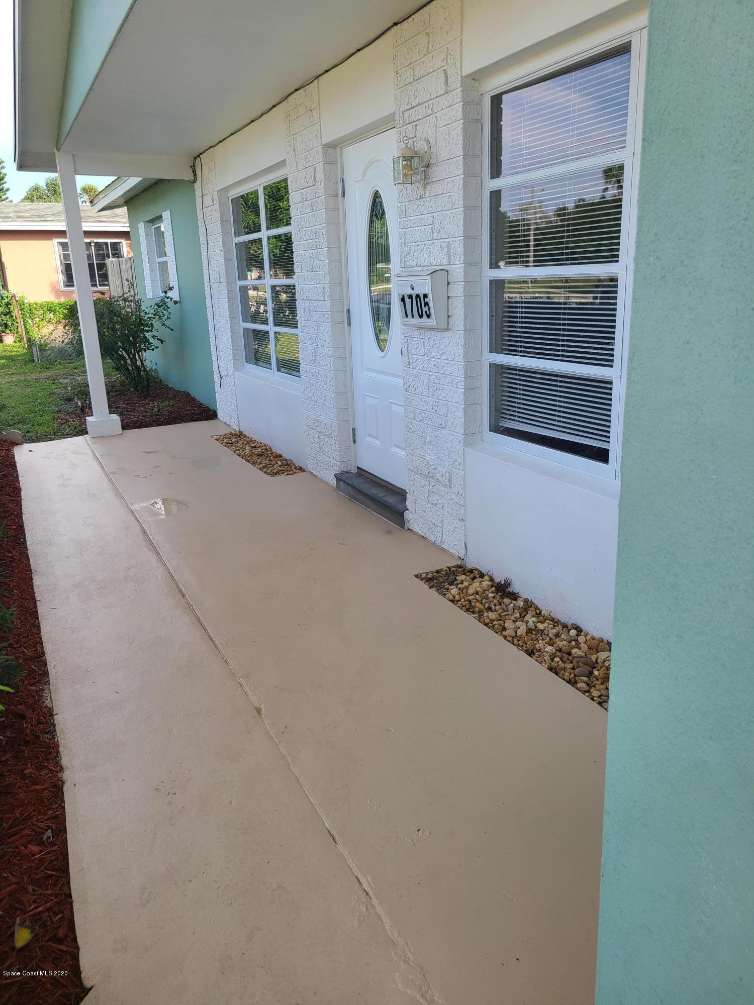 1705 Sarno (access) Road Melbourne, FL 32935 - Photo 3 of 32 a view of a house with porch
