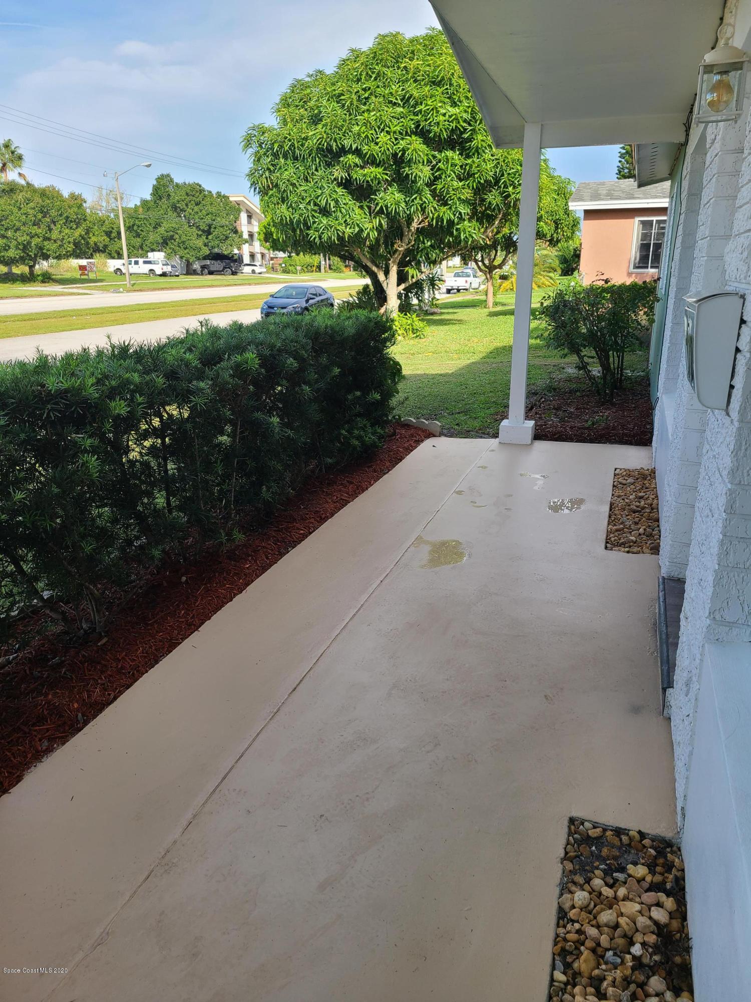 1705 Sarno (access) Road Melbourne, FL 32935 - Photo 4 of 32 a view of a garden with an outdoor space