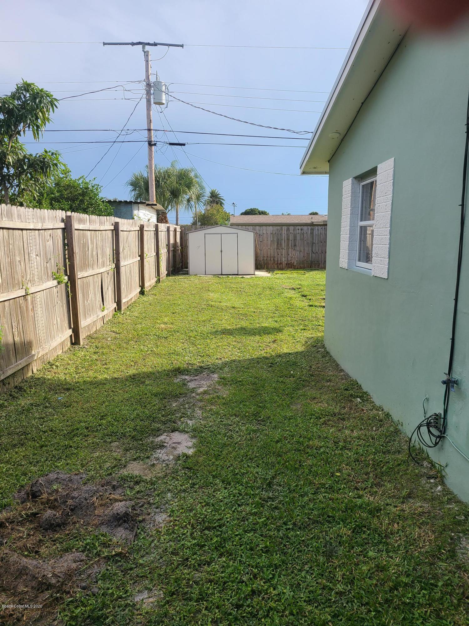 1705 Sarno (access) Road Melbourne, FL 32935 - Photo 8 of 32 a view of a backyard