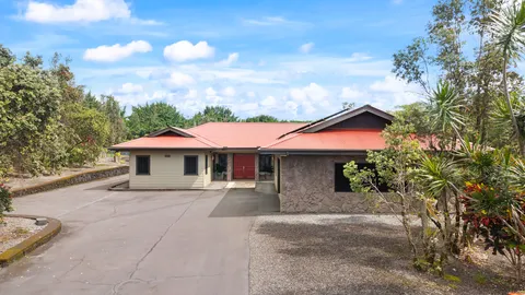 a house with trees in the background