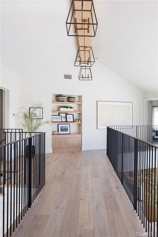 a view of a hallway with chandelier