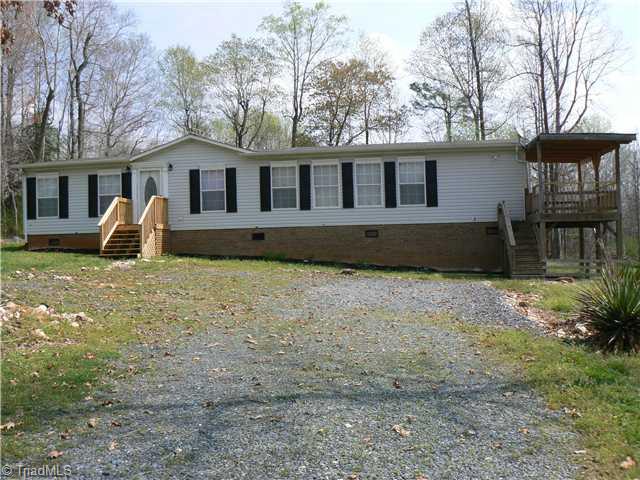 Exterior Front. This 1999 model Doublewide Home has 7 rooms, including a pantry, and is located in Southern Randolph County on .7 acres. It is on a permanent foundation with brick exterior.